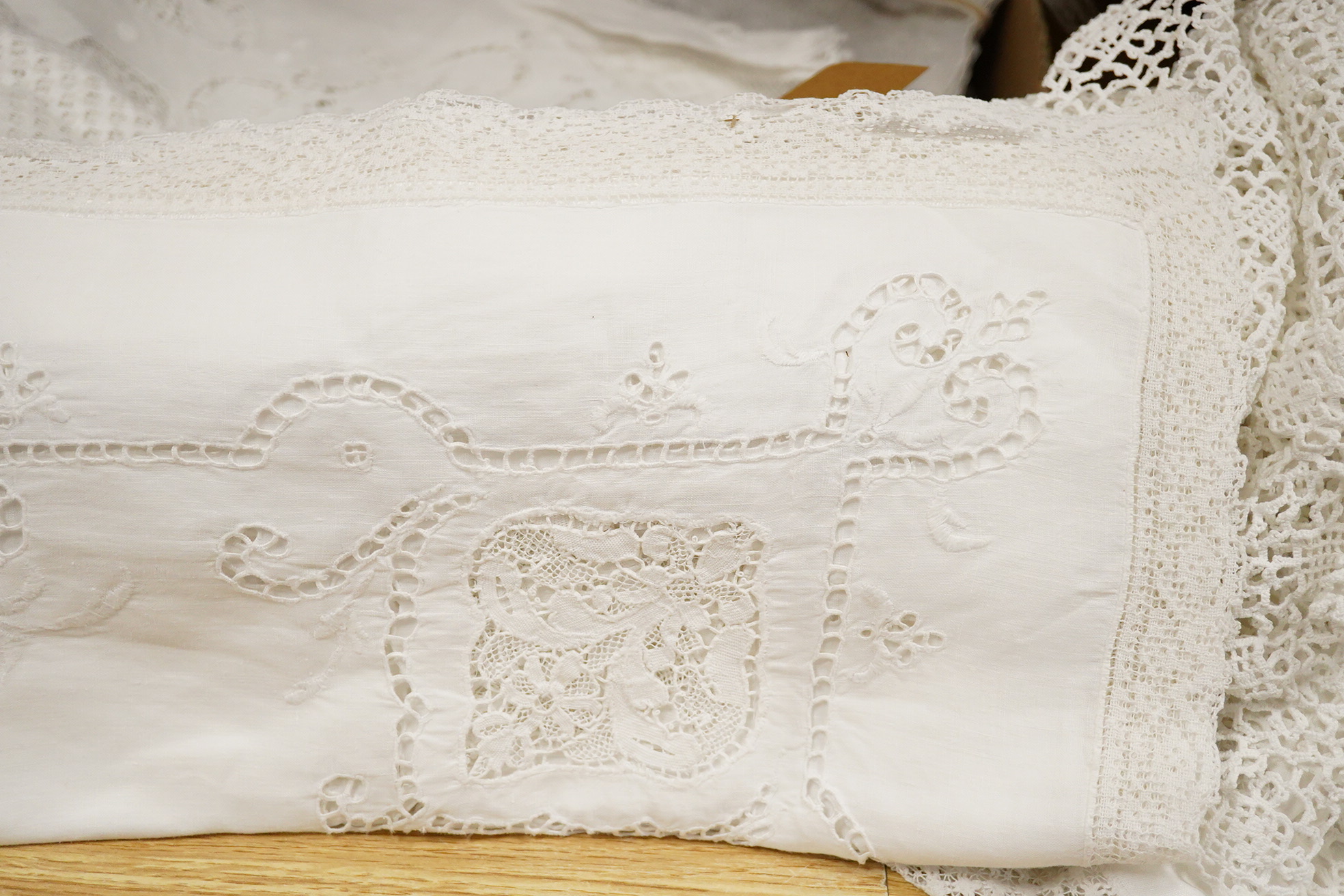 A collection of cutwork, needlework, filet, crochet and drawn thread worked table cloths etc